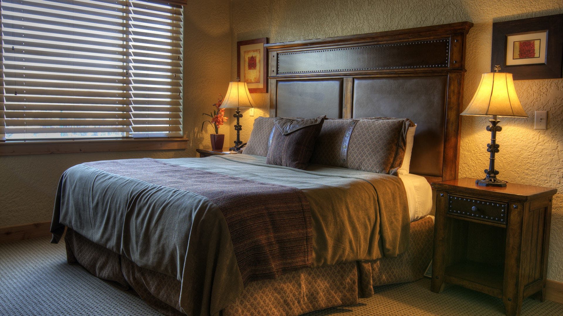 Bedroom with dark wooden bed and furniture